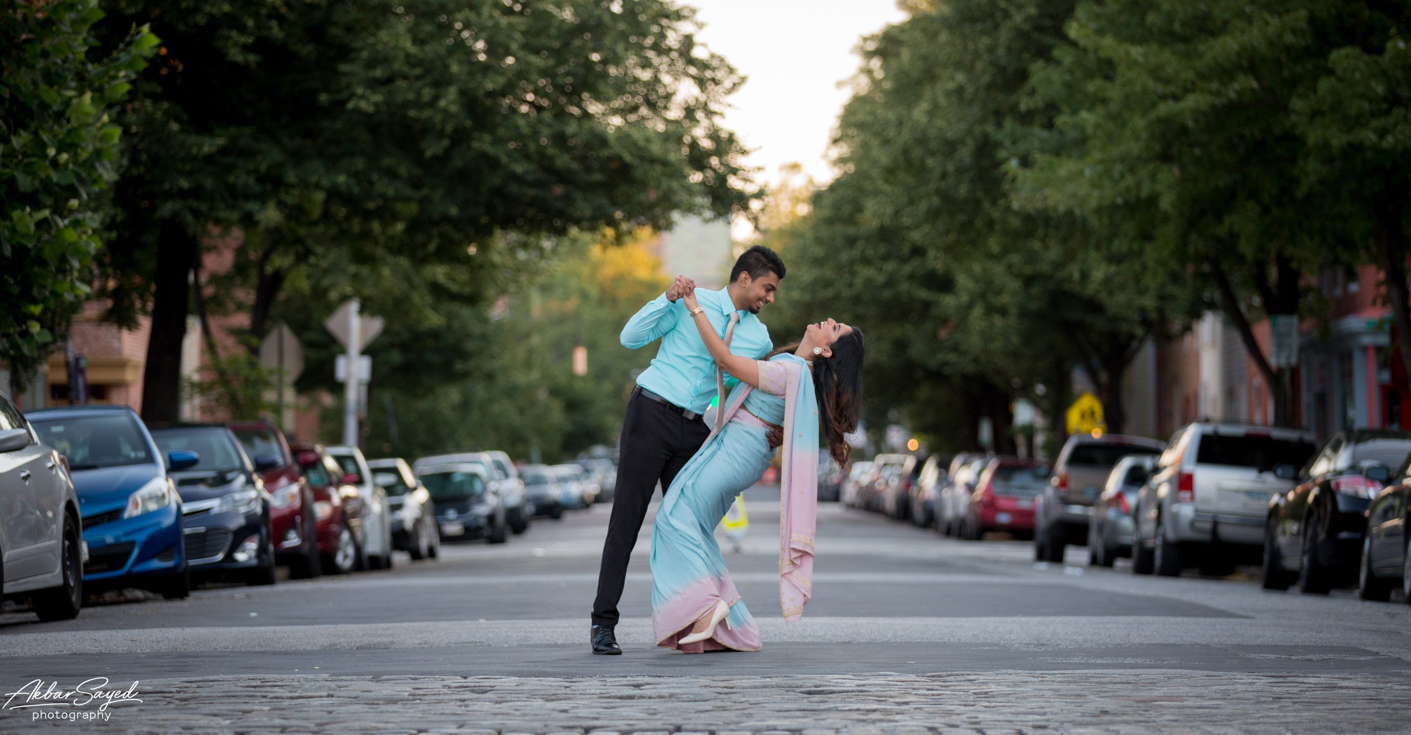 A photo of an indian couple in fells point for their baltimore engagement shoot at sunrise.